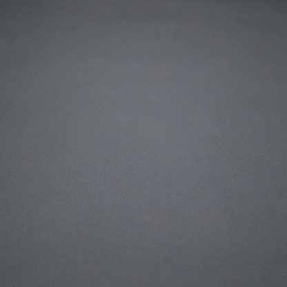 Plain, solid dark charcoal grey-coloured Hallstatt faux leather fabric texture with a smooth, fine finish.