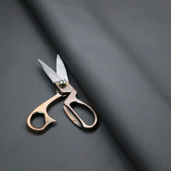 Plain, solid dark charcoal grey-coloured Hallstatt faux leather fabric texture with a smooth, fine finish.