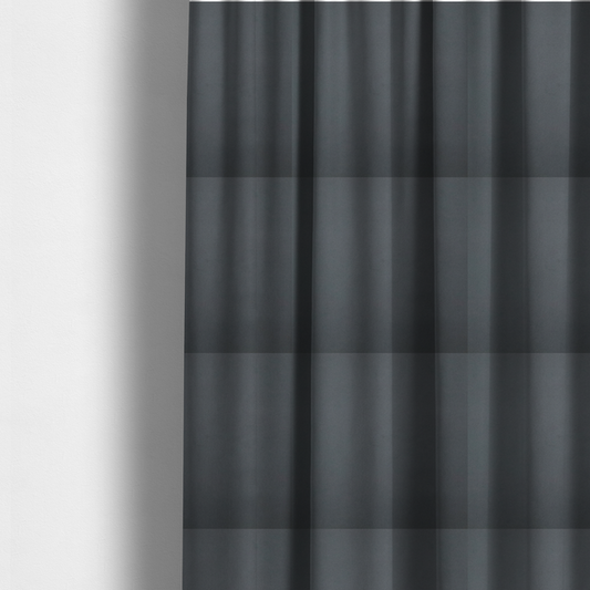 The fabric used to create these made-to-measure curtains is a plain, solid dark charcoal grey-coloured Hallstatt faux leather fabric texture with a smooth, fine finish.