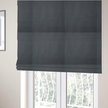 The fabric used to create these Roman blinds is a plain, solid dark charcoal grey-coloured Hallstatt faux leather fabric texture with a smooth, fine finish.