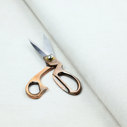 A solid light off-white or cream-coloured woven textile with a fine, subtle textured weave.