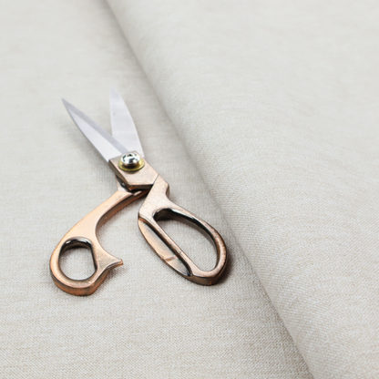A solid light off-white or cream-coloured woven textile with a fine, subtle textured weave.