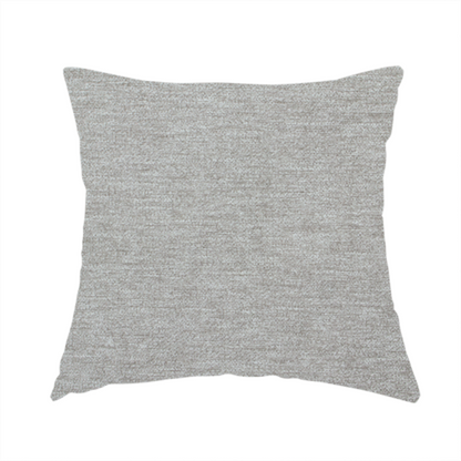 The fabric used to create this handmade cushion is a solid dark beige woven textile with a fine, subtle textured weave.
