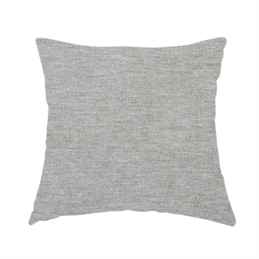 The fabric used to create this handmade cushion is a solid dark beige woven textile with a fine, subtle textured weave.