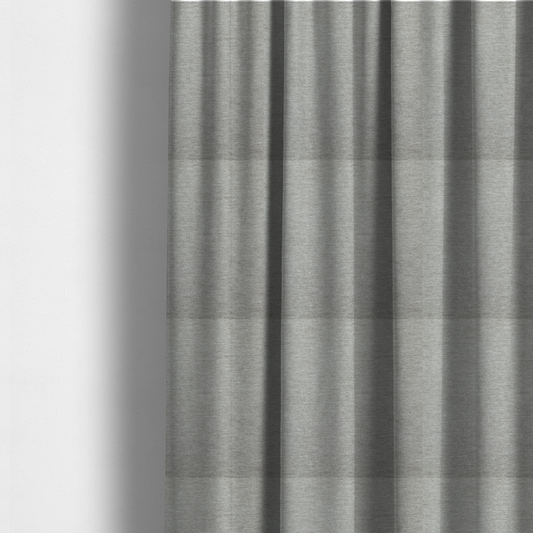 The fabric used to create these made-to-measure curtains is a solid dark beige woven textile with a fine, subtle textured weave.
