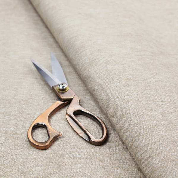 A solid beige woven textile with a fine, subtle textured weave.