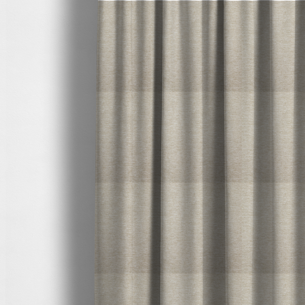 The fabric used to create these made-to-measure curtains is a solid beige woven textile with a fine, subtle textured weave.