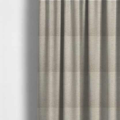 The fabric used to create these made-to-measure curtains is a solid beige woven textile with a fine, subtle textured weave.