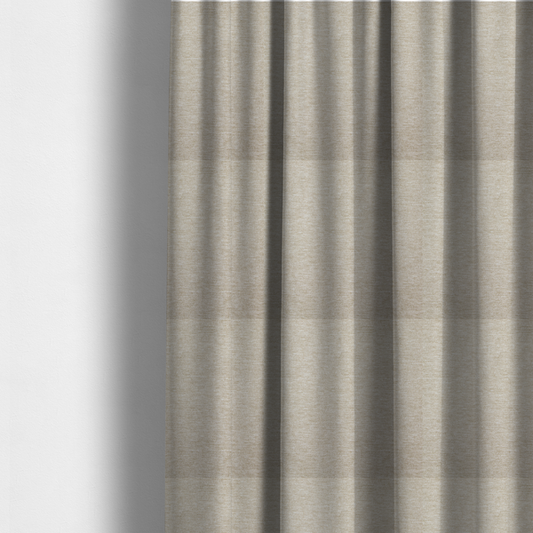 The fabric used to create these made-to-measure curtains is a solid beige woven textile with a fine, subtle textured weave.