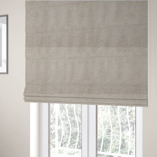 The fabric used to create these Roman blinds is a solid beige woven textile with a fine, subtle textured weave.
