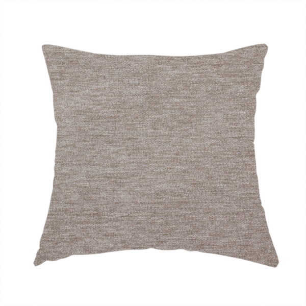 The fabric used to create this handmade cushion is a solid light brown woven textile with a fine, subtle textured weave.
