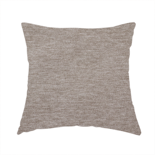 The fabric used to create this handmade cushion is a solid light brown woven textile with a fine, subtle textured weave.