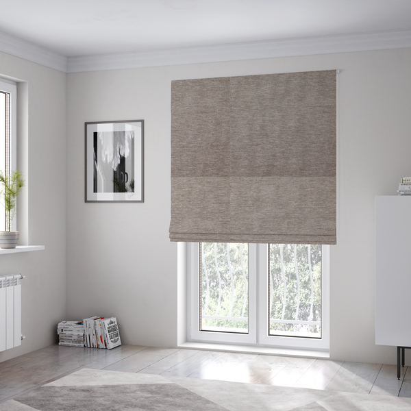 The fabric used to create these Roman blinds is a solid light brown woven textile with a fine, subtle textured weave.