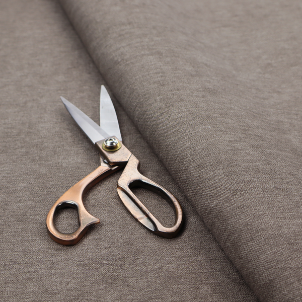 A solid brown woven textile with a fine, subtle textured weave.