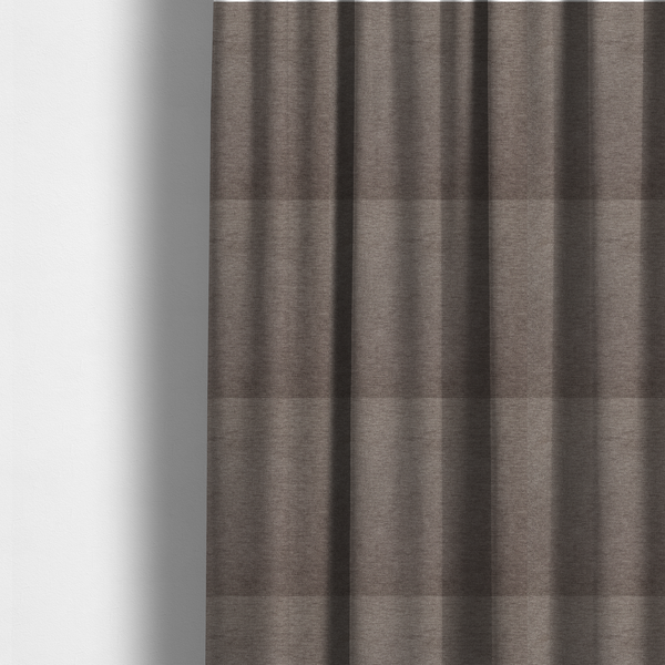 The fabric used to create these made-to-measure curtains is a solid brown woven textile with a fine, subtle textured weave.