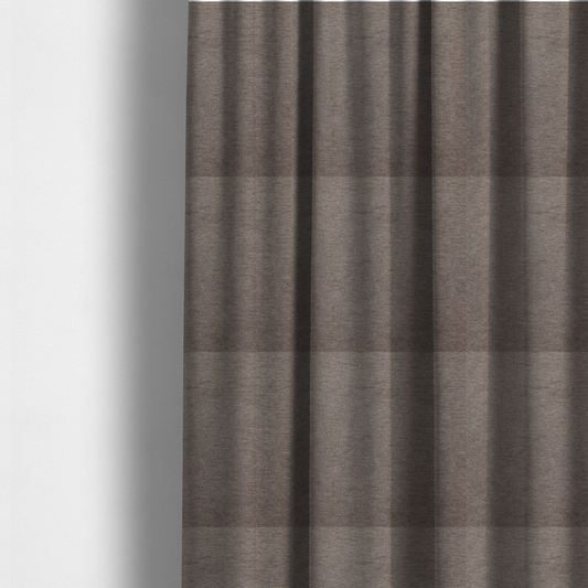 The fabric used to create these made-to-measure curtains is a solid brown woven textile with a fine, subtle textured weave.