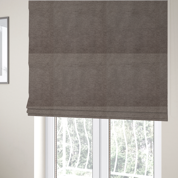 The fabric used to create these Roman blinds is a solid brown woven textile with a fine, subtle textured weave.