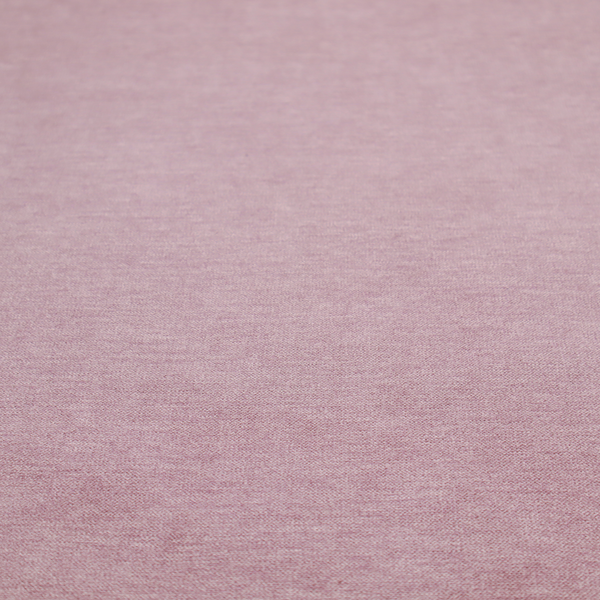 A solid pink woven textile with a fine, subtle textured weave.