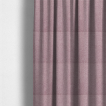 The fabric used to create these made-to-measure curtains is a solid pink woven textile with a fine, subtle textured weave.