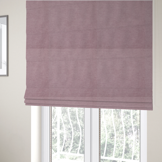 The fabric used to create these Roman blinds is a solid pink woven textile with a fine, subtle textured weave.