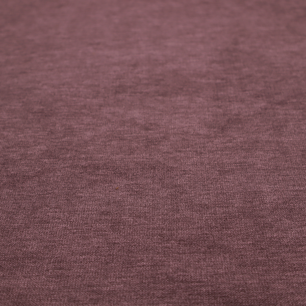 A solid dark pink or mauve woven textile with a fine, subtle textured weave.