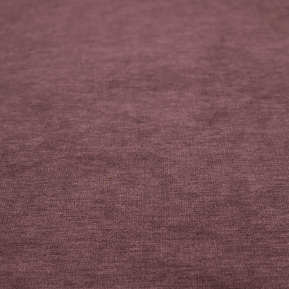 A solid dark pink or mauve woven textile with a fine, subtle textured weave.