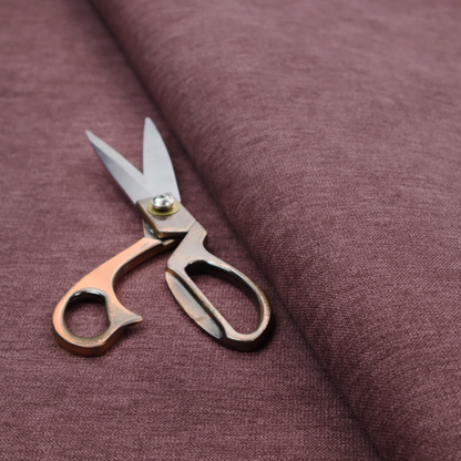 A solid dark pink or mauve woven textile with a fine, subtle textured weave.