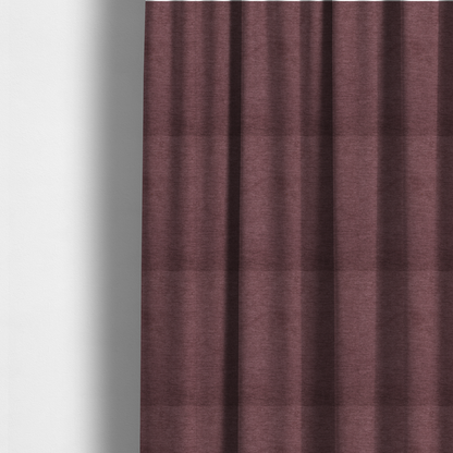 The fabric used to create these made-to-measure curtains is a solid dark pink or mauve woven textile with a fine, subtle textured weave.