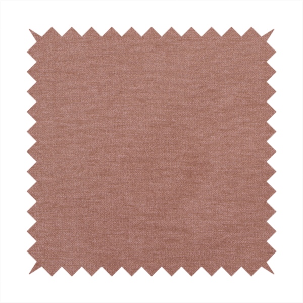 A solid muted pink or dusty rose woven textile with a fine, subtle textured weave.