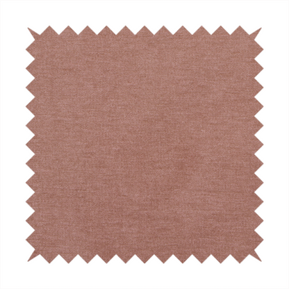 A solid muted pink or dusty rose woven textile with a fine, subtle textured weave.