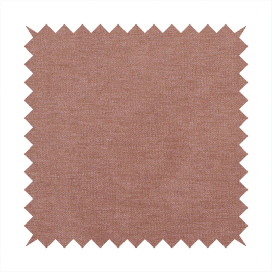 A solid muted pink or dusty rose woven textile with a fine, subtle textured weave.