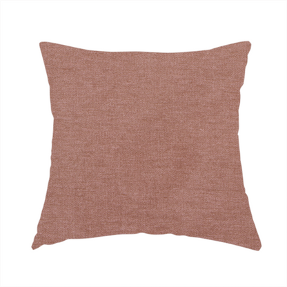 The fabric used to create this handmade cushion is a solid muted pink or dusty rose woven textile with a fine, subtle textured weave.