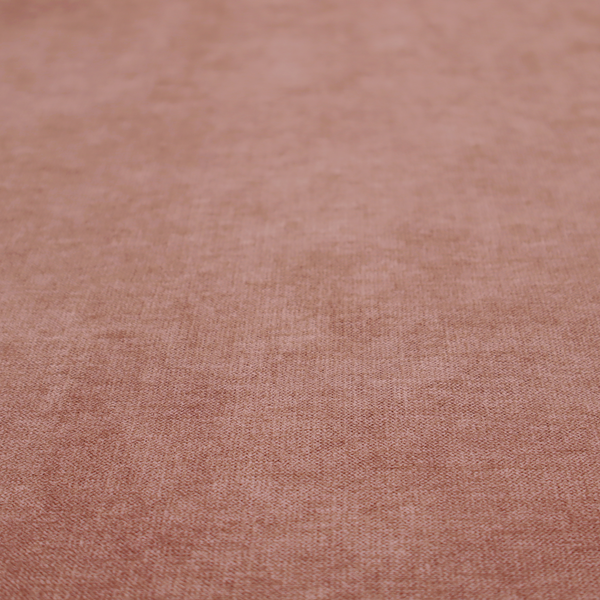 A solid muted pink or dusty rose woven textile with a fine, subtle textured weave.