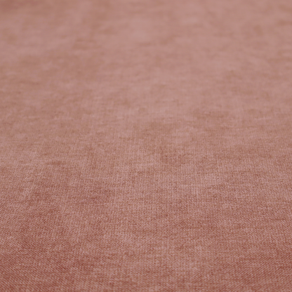 A solid muted pink or dusty rose woven textile with a fine, subtle textured weave.