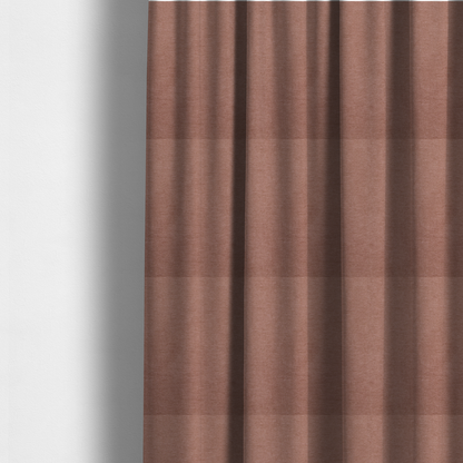 The fabric used to create these made-to-measure curtains is a solid muted pink or dusty rose woven textile with a fine, subtle textured weave.