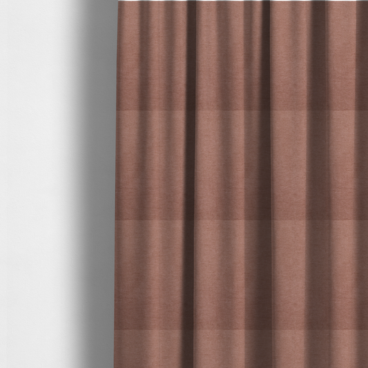 The fabric used to create these made-to-measure curtains is a solid muted pink or dusty rose woven textile with a fine, subtle textured weave.