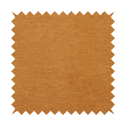 A solid orange or mustard yellow woven textile with a fine, subtle textured weave.