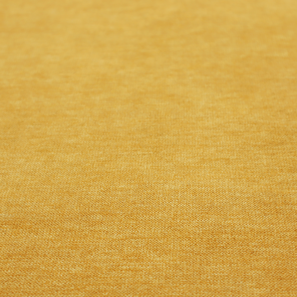 A solid mustard yellow woven textile with a fine, subtle textured weave.