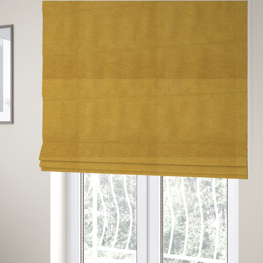 The fabric used to create these Roman blinds is a solid mustard yellow woven textile with a fine, subtle textured weave.
