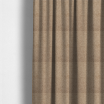 The fabric used to create these made-to-measure curtains is a solid light brown or taupe woven textile with a fine, subtle textured weave.