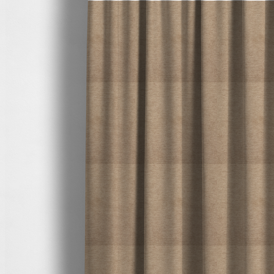 The fabric used to create these made-to-measure curtains is a solid light brown or taupe woven textile with a fine, subtle textured weave.
