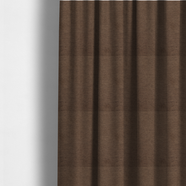 the fabric used to create these made-to-measure curtains is a solid dark brown woven fabric swatch with a fine, subtle texture.