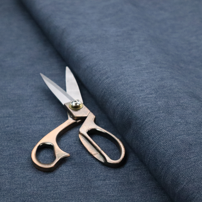 A solid blue woven textile with a fine, subtle textured weave.