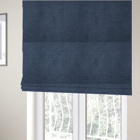 the fabric used to create these Roman blinds is a solid blue woven textile with a fine, subtle textured weave.