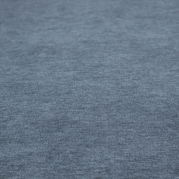 A solid light blue or steel blue woven textile with a fine, subtle textured weave.