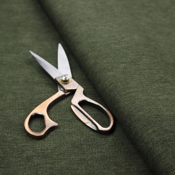 A solid dark green woven fabric swatch with a fine, subtle texture.