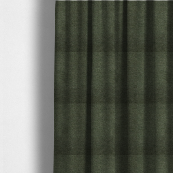 The fabric used to create these made-to-measure curtains is a solid dark green woven fabric swatch with a fine, subtle texture.