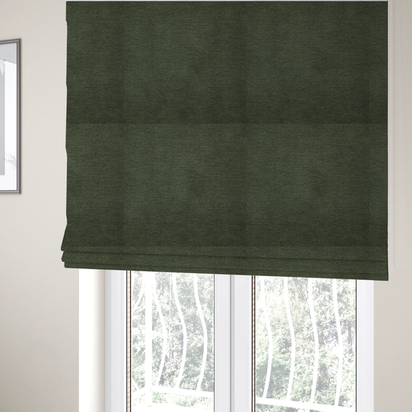 The fabric used to create these Roman blinds is a solid dark green woven fabric swatch with a fine, subtle texture.