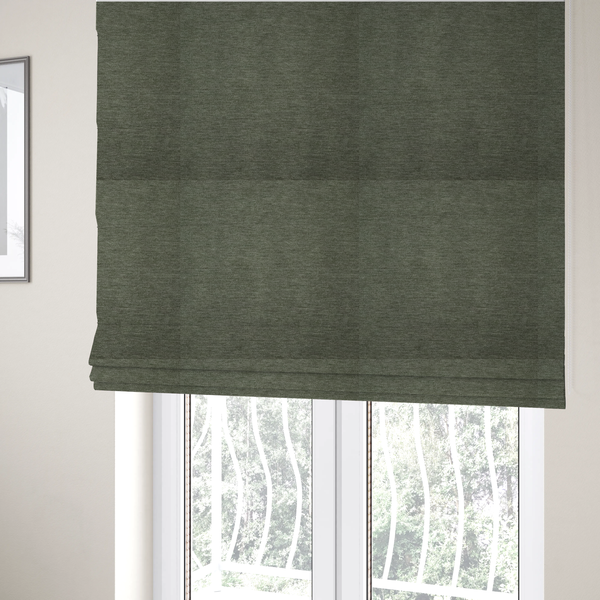 The fabric used to create these Roman blinds is a solid sage green woven fabric swatch with a fine, subtle texture.