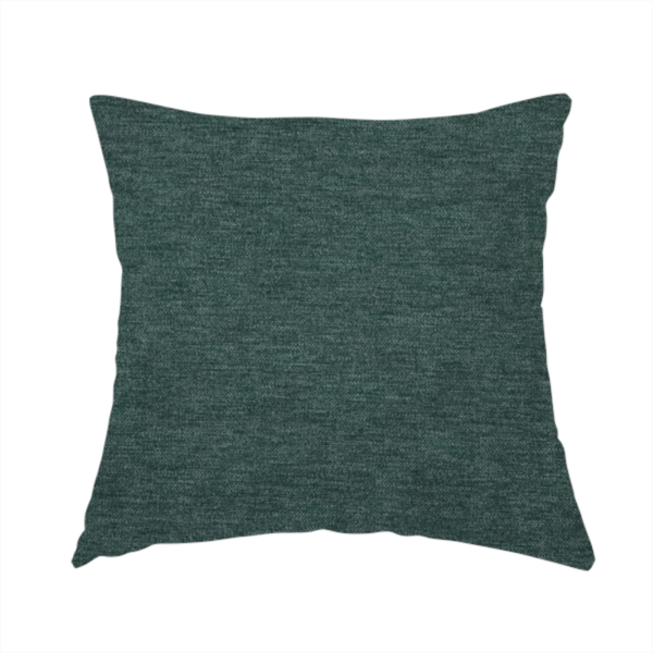 The fabric used to create this handmade cushion is a solid teal or deep turquoise woven textile with a fine, subtle textured weave.